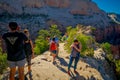 ZION, UTAH, USA - JUNE 14, 2018: Outdoor beautiful view of young hikers looking at view in Zion National park. People