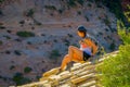 ZION, UTAH, USA - JUNE 12, 2018: Outdoor beautiful view of young woman with beautiful scenery in Zion National Park