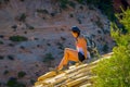 ZION, UTAH, USA - JUNE 12, 2018: Outdoor beautiful view of young woman with beautiful scenery in Zion National Park