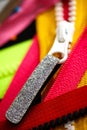 Zip background texture of zippers sliders. a lot of zippers in different colors. sewing clothes, atelier, fabric and accessories s