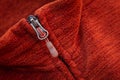 Zip zipper close up macro on red clothes background Royalty Free Stock Photo