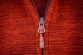 Zip zipper close up macro on red clothes background Royalty Free Stock Photo
