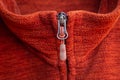 Zip zipper close up macro on red clothes background Royalty Free Stock Photo