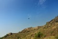 Zipline tourist flying over Rao Jodha Desert Rock Park, Jodhpur, Rajasthan, India. Near the historic Mehrangarh Fort , park