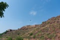 Zipline tourist flying over Rao Jodha Desert Rock Park, Jodhpur, Rajasthan, India.