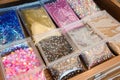 ziplock bags of sequins and beads in drawer