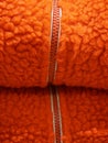 Zipper on orange wool texture background