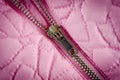 Zipper on pink balon jacket close-up shot