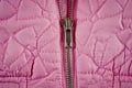 Zipper on pink balon jacket close-up shot