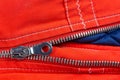 Zipper of a Red and Blue Down Jacket