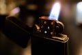 Zippo lighter closeup with flame burning