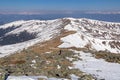 Zirbitzkogel - Woman hiking on snow covered alpine pasture and ridges near Zirbitzkogel, Seetal Alps, Styria, Austria, Europe.