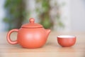 Zisha Xishi milk teapot and a tea bowl