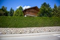 Green bush fence on a beautiful house