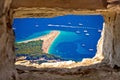 Zlatni rat beach aerial view through stone window Royalty Free Stock Photo