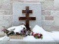 Zlatoust, Chelyabinsk region, Russia, January, 19, 2020. Memorial cross at the wall of the bell tower in Zlatoust on Red hill in w