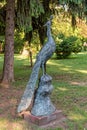 Sculpture Peacock on the complex Zobnatica. A stone statue in the form of a sacred animal peacock