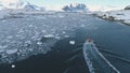 Zodiac boat in Antarctica ocean aerial