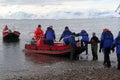 Zodiac boats ferry passengers to shore during a Christmas cruise