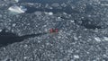 Zodiac motor boat sailing in Antarctic ice. Aerial Tracking Royalty Free Stock Photo