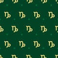 Zodiac seamless pattern. Repeating capricorn gold sign with stars on the green background. Vector horoscope symbol Royalty Free Stock Photo
