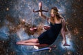 Zodiac sign Libra, presented by beautiful girl among space galaxies. Intersects with the theme of the goddess Themis.