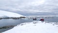 Zodiacs approaching snow covered slopes in Antarctica