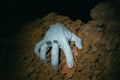 Zombie hand coming out of his grave Royalty Free Stock Photo