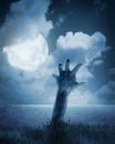 Zombie hand coming out of his grave Royalty Free Stock Photo