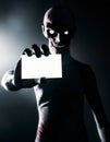 Zombie holding blank business card