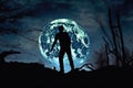 zombie silhouette against a full moon and dark sky