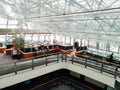 Zone of a restaurant or cafe under the transparent roof of a luxury hotel