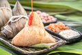 Zongzi, steamed rice dumplings with chili sauce. Close up, copy space, famous asian tasty food in dragon boat duanwu festival