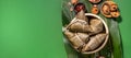 Zongzi, steamed rice dumplings on green table background, food in dragon boat festival duanwu concept, close up, copy space, top