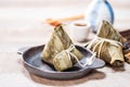 Zongzirice dumpling with a cup of tea on a wood table, Dragon Boat Festival, Asian traditional food Royalty Free Stock Photo