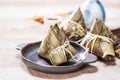 Zongzirice dumpling with a cup of tea on a wood table, Dragon Boat Festival, Asian traditional food Royalty Free Stock Photo