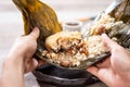 Zongzirice dumpling with a cup of tea on a wood table, Dragon Boat Festival, Asian traditional food Royalty Free Stock Photo