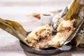 Zongzirice dumpling with a cup of tea on a wood table, Dragon Boat Festival, Asian traditional food Royalty Free Stock Photo