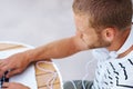 Zoning in on a new idea. High angle shot of a handsome young man working on a laptop outside. Royalty Free Stock Photo