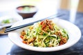 zoodles with diced tofu and soy sauce in a dish Royalty Free Stock Photo