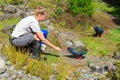 Zookeeper feeding two endangered takahe, Auckland Zoo, New Zealand