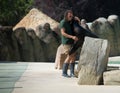 Zookeeper giving a Sealion a hug