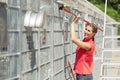 Zookeeper woman working on cleaning cage in animal shelter Royalty Free Stock Photo