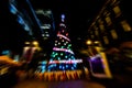 Zoom blur night photography of colorful sparkles providing a visual spectacle and light up the branches of the Christmas tree. Royalty Free Stock Photo