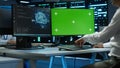 Zoom in of expert in data center using artificial intelligence on mockup PC