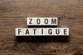 Zoom fatigue - word concept on building blocks, text