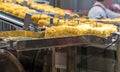 Zoom-in instant noodles on transmission belt in production