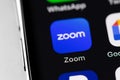 Zoom mobile icon app on the screen smartphone iPhone closeup. Zoom Video Communications is a company that provides remote
