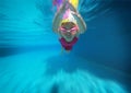 Happy asian kid swimming underwater in summer. Royalty Free Stock Photo