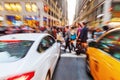 Zoom picture of a street scene with crossing people in Manhattan, New York City